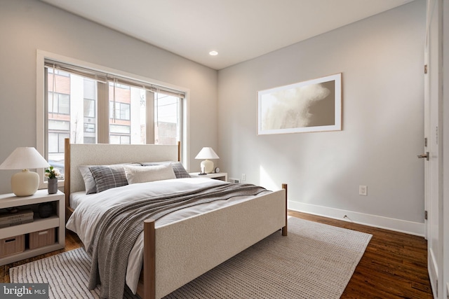 bedroom with recessed lighting, baseboards, and wood finished floors