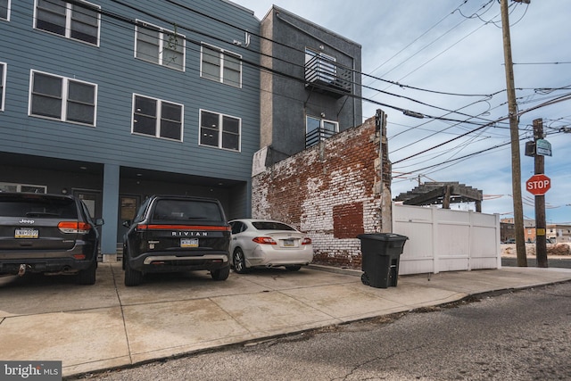 view of property with concrete driveway