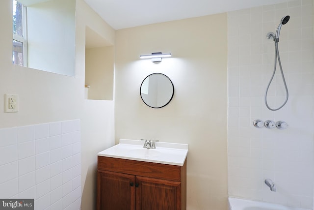 bathroom with bathtub / shower combination and vanity