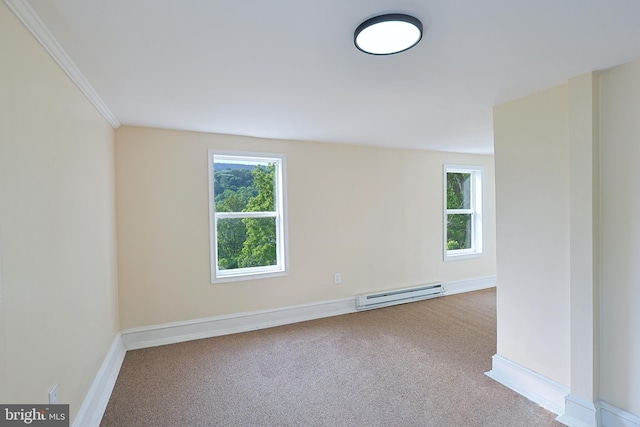 carpeted empty room with a healthy amount of sunlight, baseboards, a baseboard heating unit, and ornamental molding