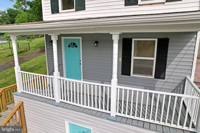 view of exterior entry featuring a porch