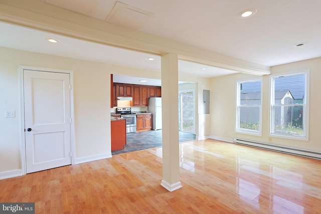 unfurnished living room with baseboards, beamed ceiling, light wood-style floors, a baseboard heating unit, and recessed lighting