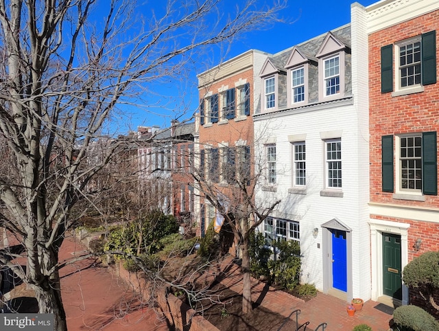 view of front of house with brick siding