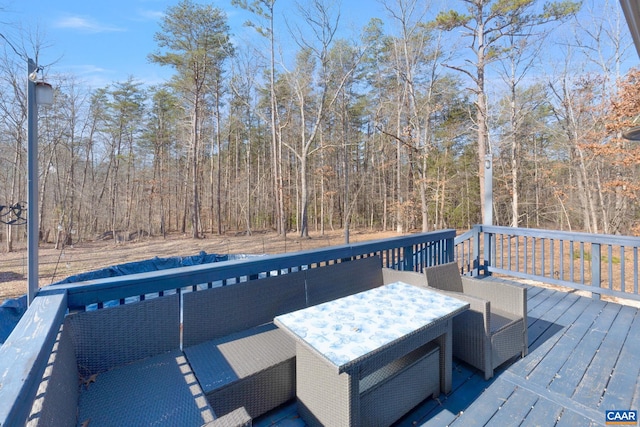 wooden terrace with outdoor dining area