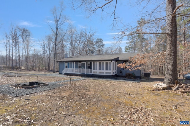 view of front of home featuring a sunroom