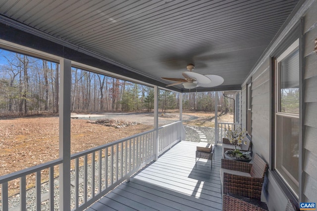 wooden deck featuring ceiling fan