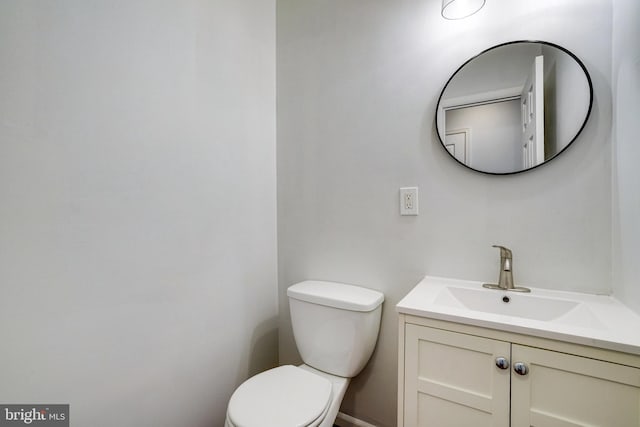 bathroom with toilet and vanity