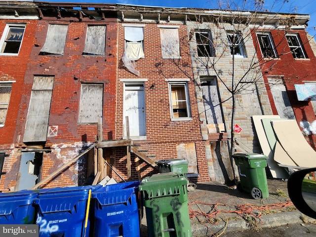 view of property featuring brick siding