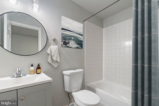 bathroom with toilet, shower / bath combination with curtain, and vanity