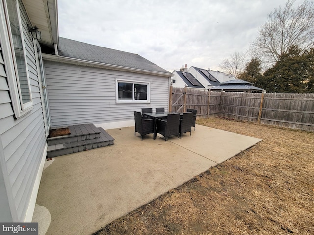 view of patio / terrace featuring fence and outdoor dining space