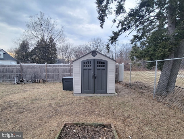 view of shed with a fenced backyard