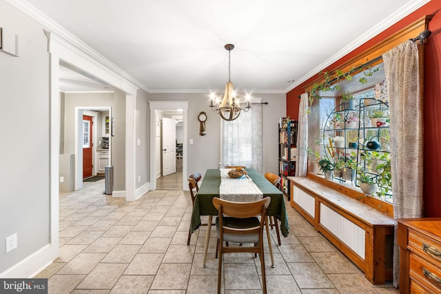 dining space featuring an inviting chandelier, light tile patterned floors, baseboards, and crown molding