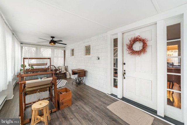 sunroom / solarium with a ceiling fan