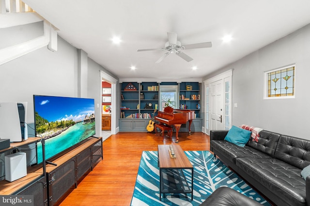 living area featuring ceiling fan, light wood-style flooring, and recessed lighting