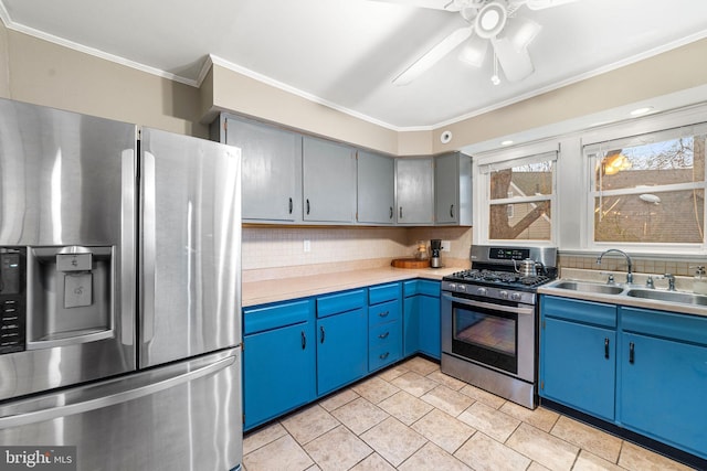 kitchen with stainless steel appliances, a sink, light countertops, ornamental molding, and decorative backsplash