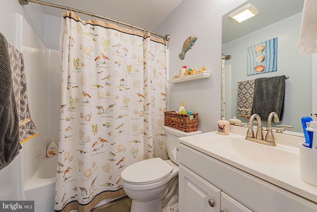 bathroom featuring toilet, shower / tub combo, and vanity