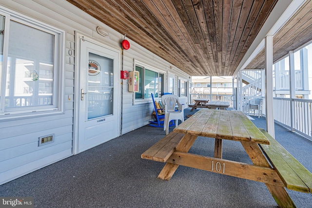 exterior space featuring wooden ceiling and a wealth of natural light