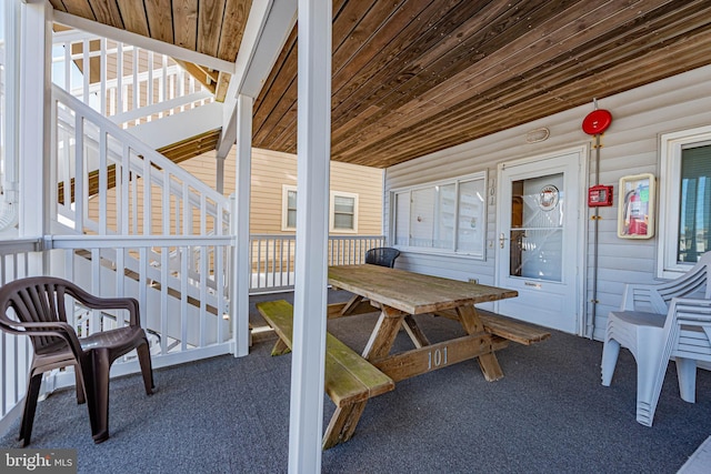 view of patio / terrace featuring stairs and outdoor dining space