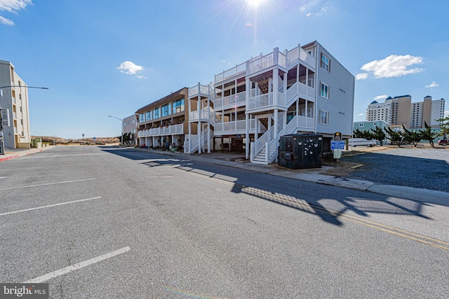 view of building exterior featuring uncovered parking