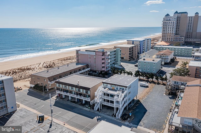 drone / aerial view with a view of the beach and a water view