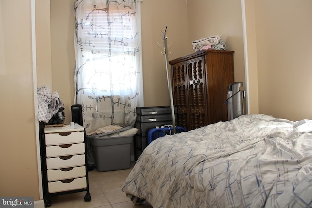 bedroom featuring light tile patterned floors