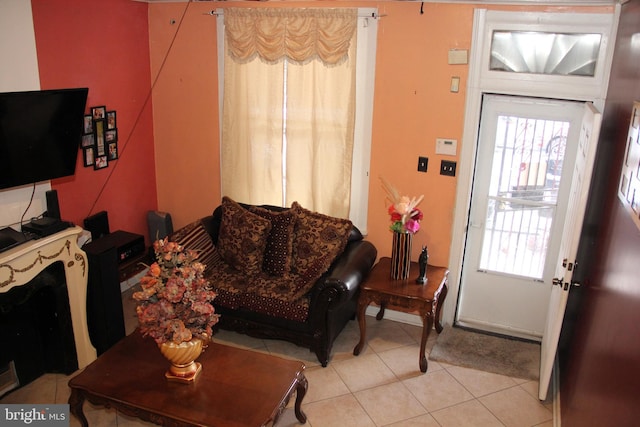 living area featuring light tile patterned flooring and plenty of natural light