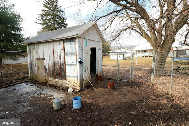 view of outdoor structure featuring an outdoor structure and fence