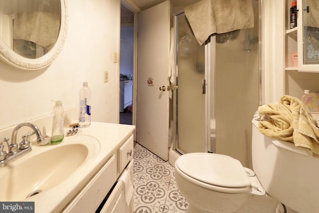 full bathroom with a stall shower, tile patterned flooring, vanity, and toilet