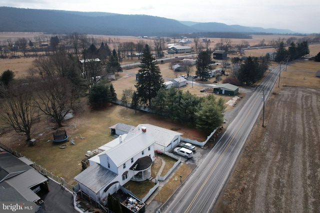 birds eye view of property featuring a rural view and a mountain view