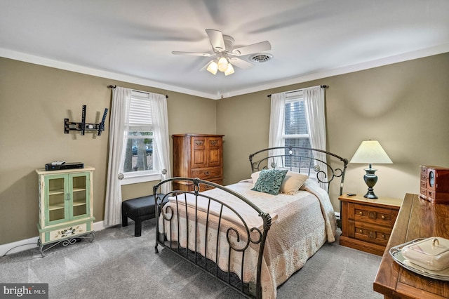 bedroom featuring carpet floors, visible vents, baseboards, and ceiling fan