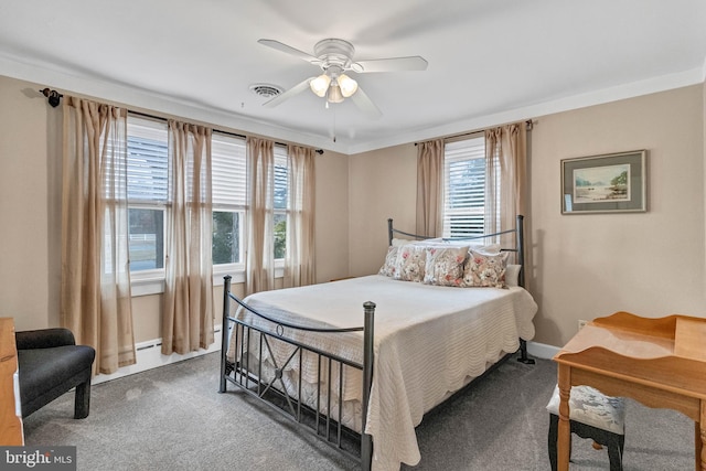 bedroom with carpet, visible vents, baseboards, and multiple windows