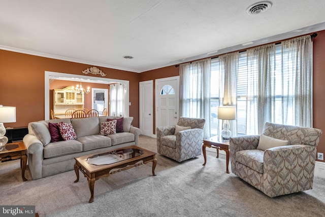 living room featuring carpet floors, a wealth of natural light, visible vents, and an inviting chandelier