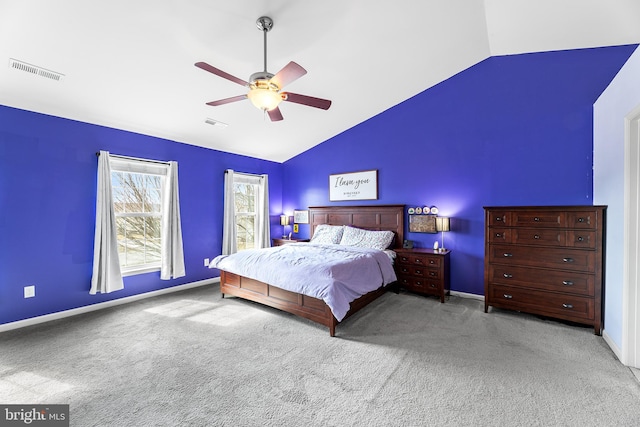 carpeted bedroom featuring a ceiling fan, lofted ceiling, visible vents, and baseboards