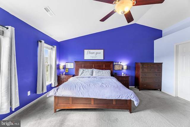 bedroom featuring carpet, visible vents, vaulted ceiling, ceiling fan, and baseboards