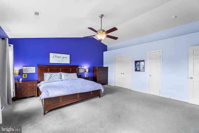 bedroom with a ceiling fan, lofted ceiling, and carpet