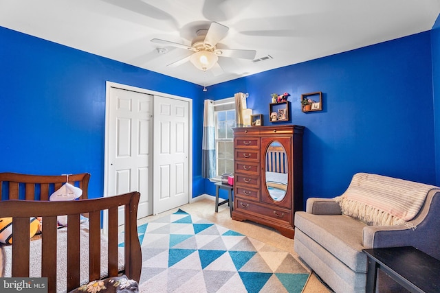 bedroom featuring carpet, a closet, visible vents, a ceiling fan, and baseboards