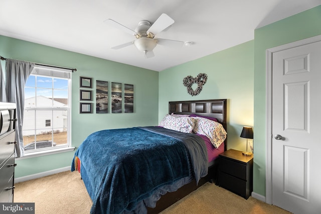 bedroom featuring carpet, a ceiling fan, and baseboards