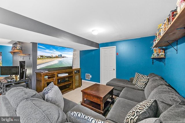 living room featuring carpet, visible vents, and baseboards