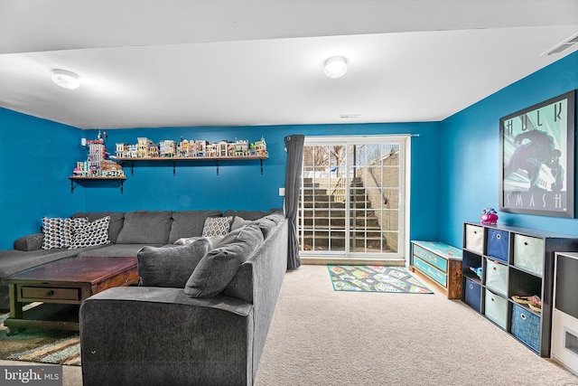 carpeted living room with visible vents