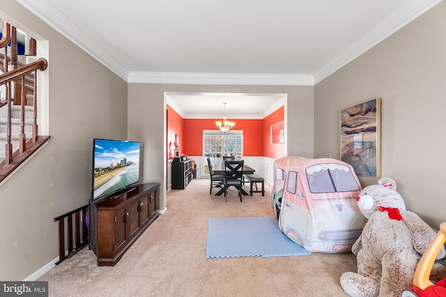 interior space with baseboards, ornamental molding, an inviting chandelier, and light colored carpet