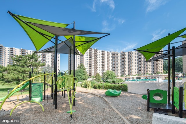 communal playground featuring a view of city