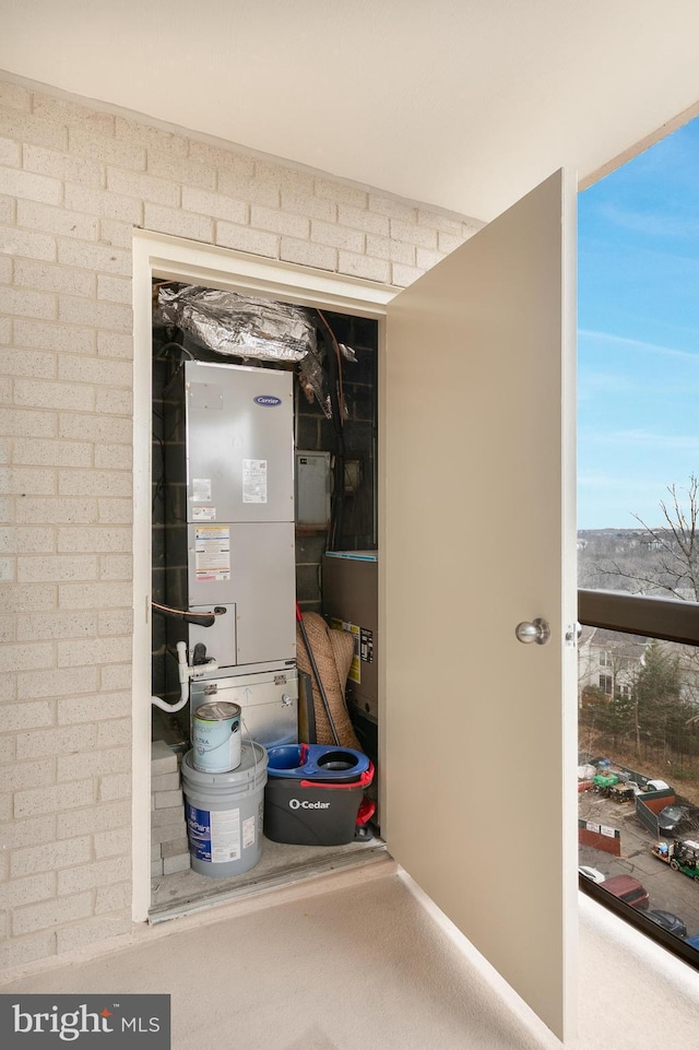 utility room with heating unit