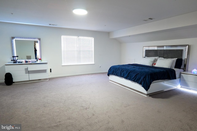 bedroom featuring carpet, visible vents, and baseboards