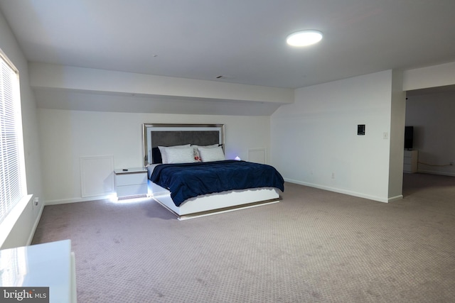 bedroom with carpet and baseboards