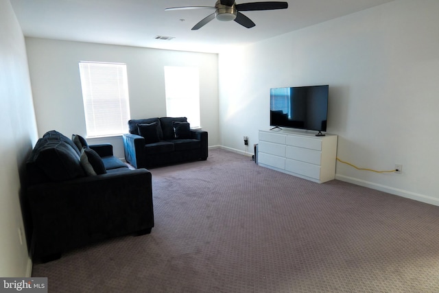 carpeted living area with visible vents, ceiling fan, and baseboards