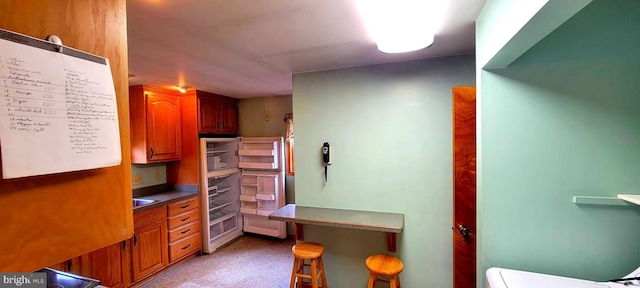 interior space with light floors and brown cabinetry