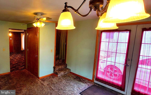 carpeted entryway featuring baseboards and french doors