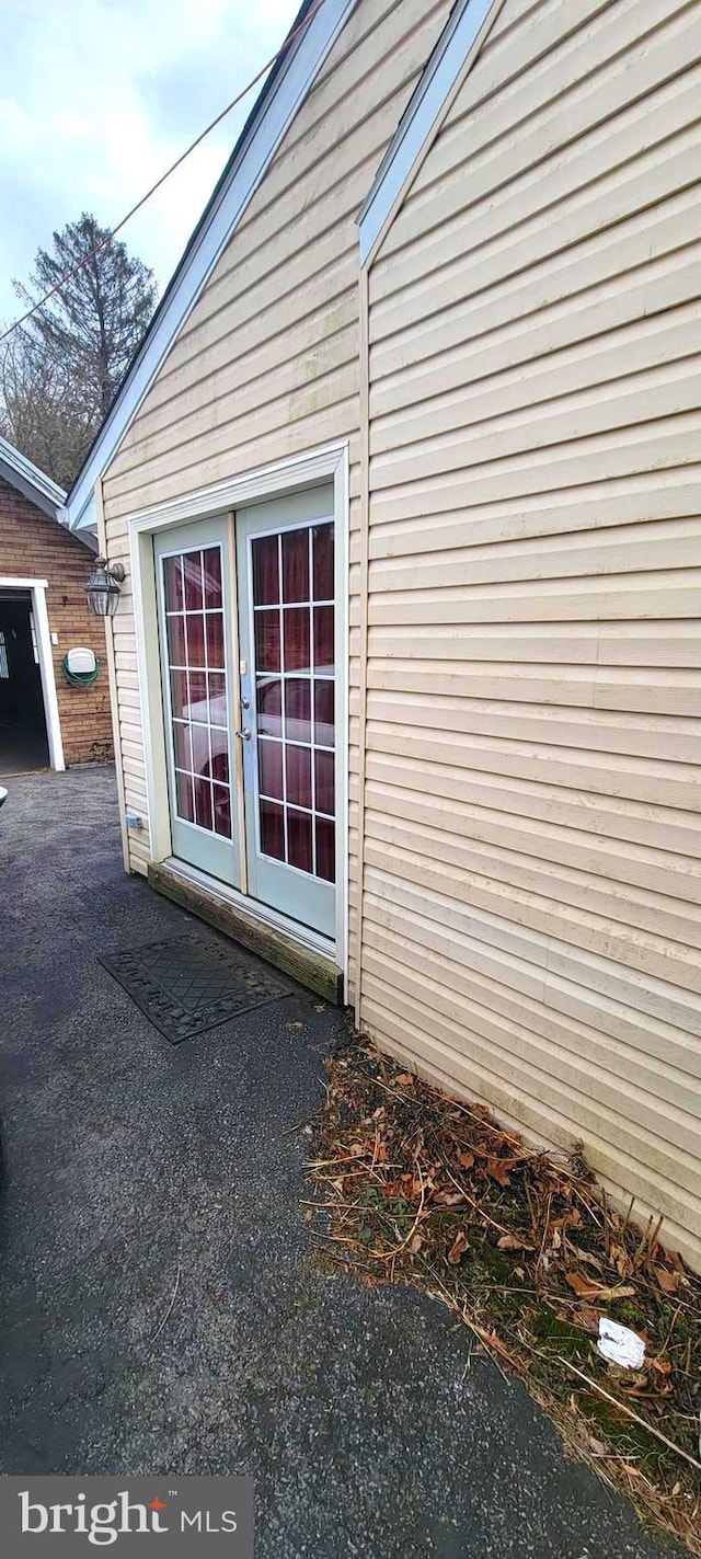 view of property exterior with french doors