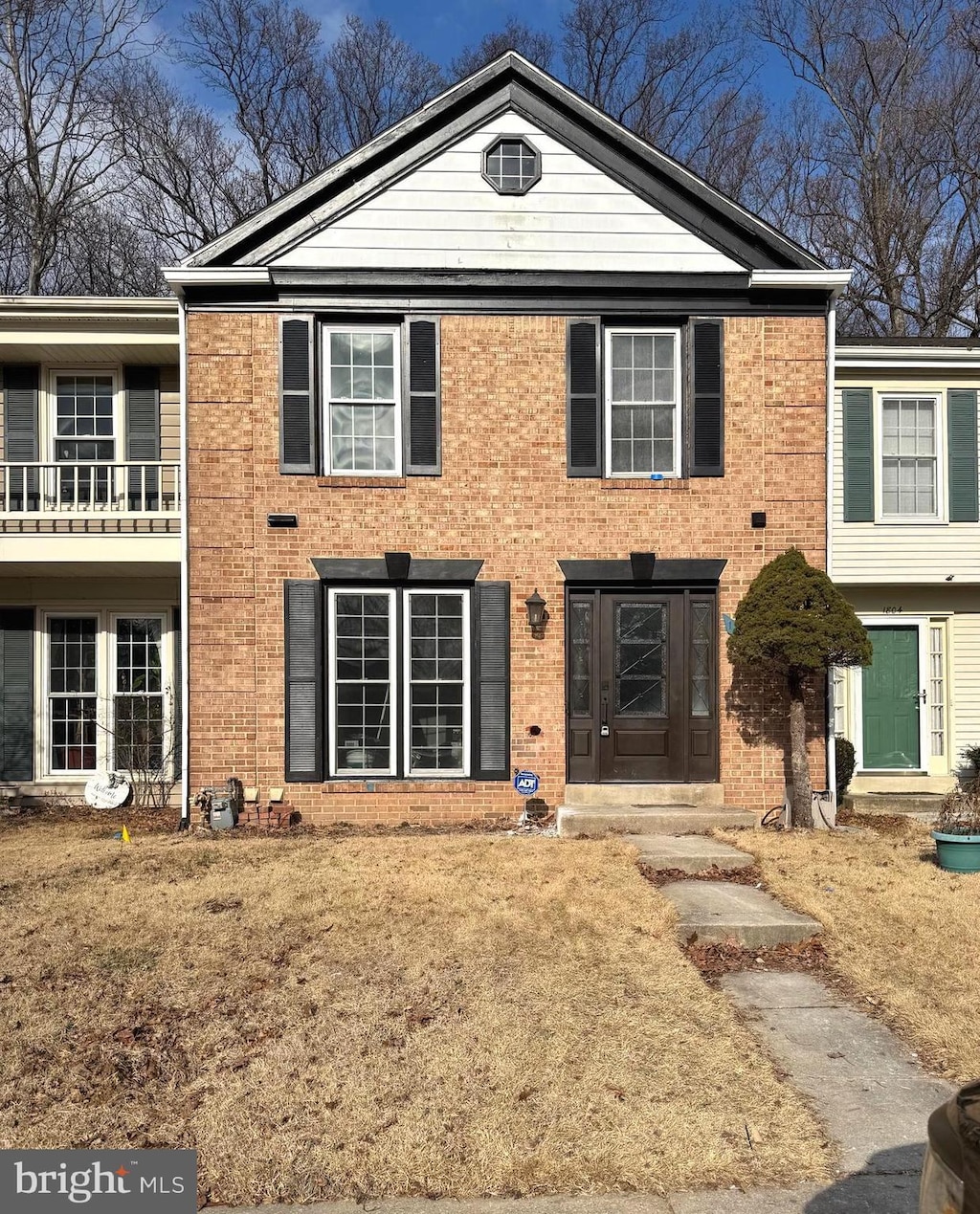 view of front of house with brick siding