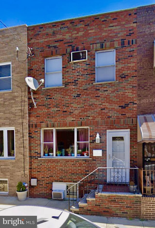 view of front of house with brick siding